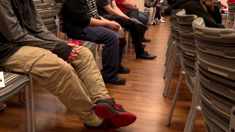 teenage boys sit and listen to speakers at first ever Burke County Youth Intervention Seminar