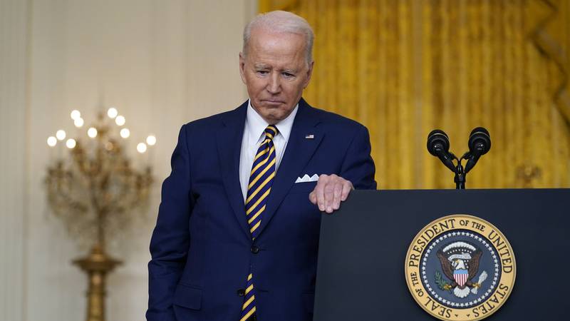 President Joe Biden listens to a question during a news conference in the East Room of the...