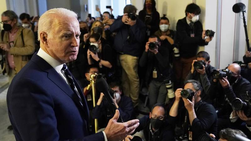 President Joe Biden speaks to the media after meeting privately with Senate Democrats,...