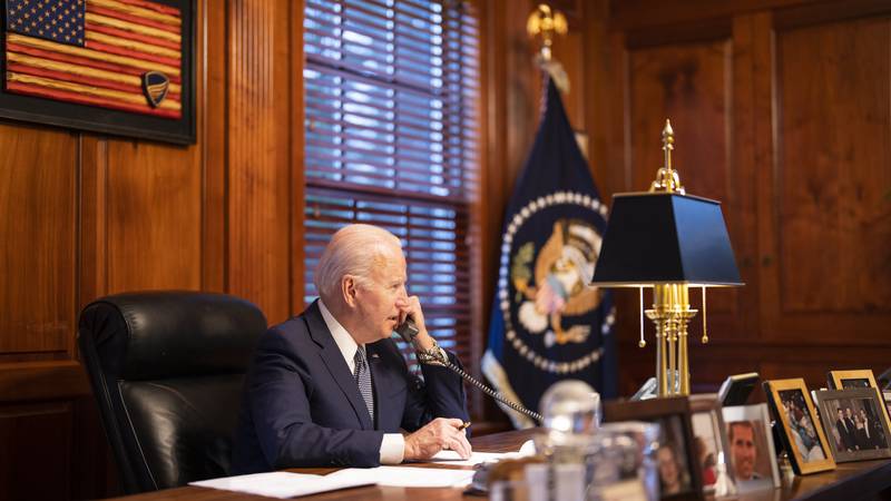In this image provided by The White House, President Joe Biden speaks with Russian President...